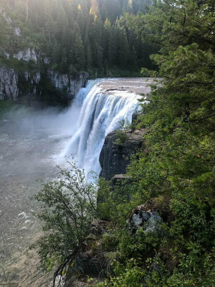 Large waterfall surrounded by greenery - Idaho