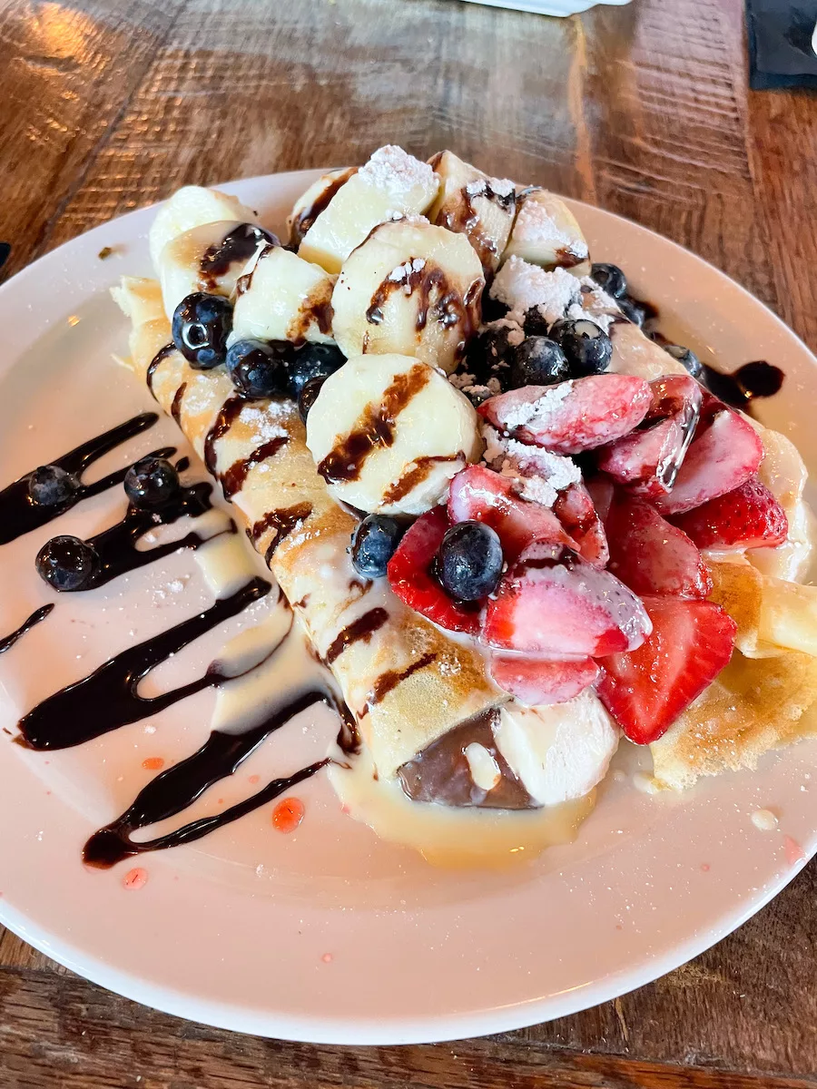 Crepe with Nutella, whipped cream, bananas, strawberries and blueberries in Springfield, MO. 