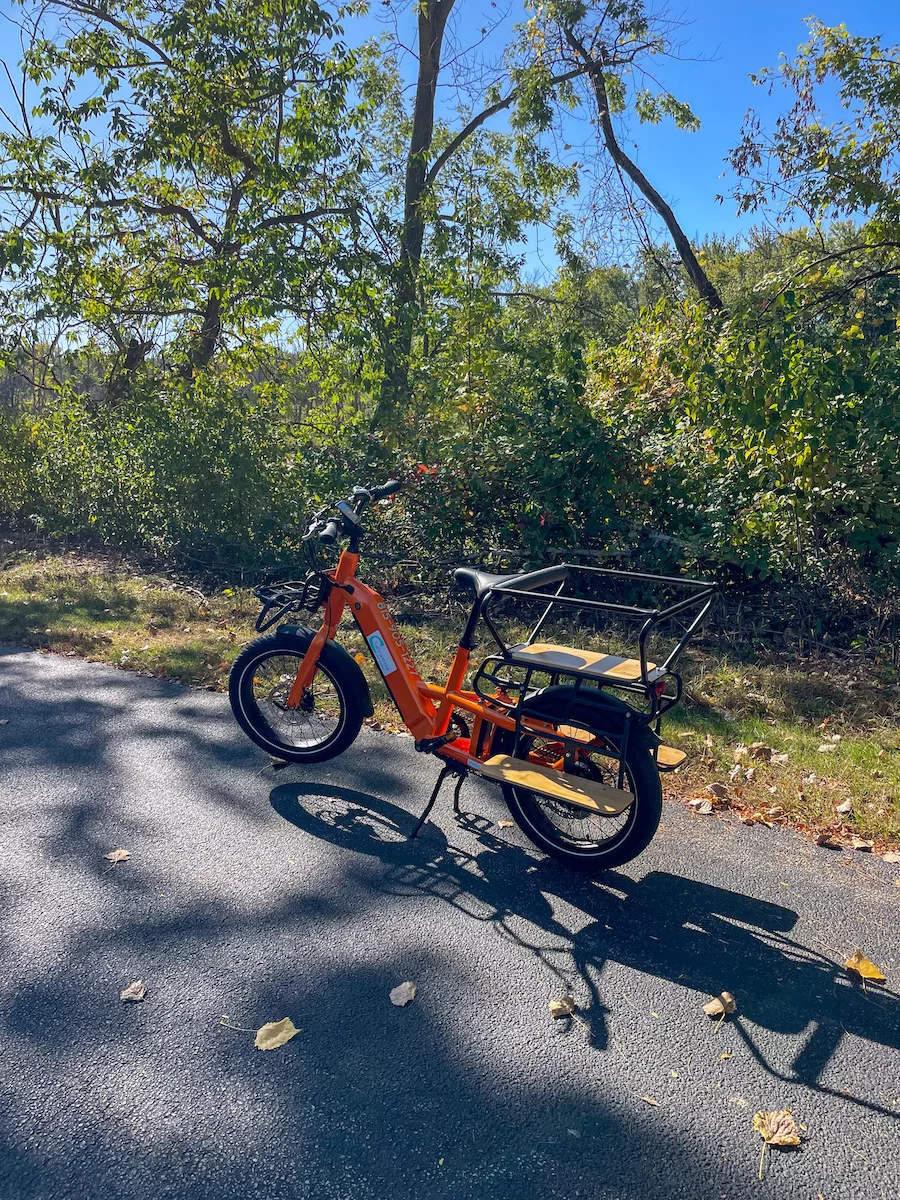Orange e-bicycle on The Great River Trail in Carroll County, IL. 
