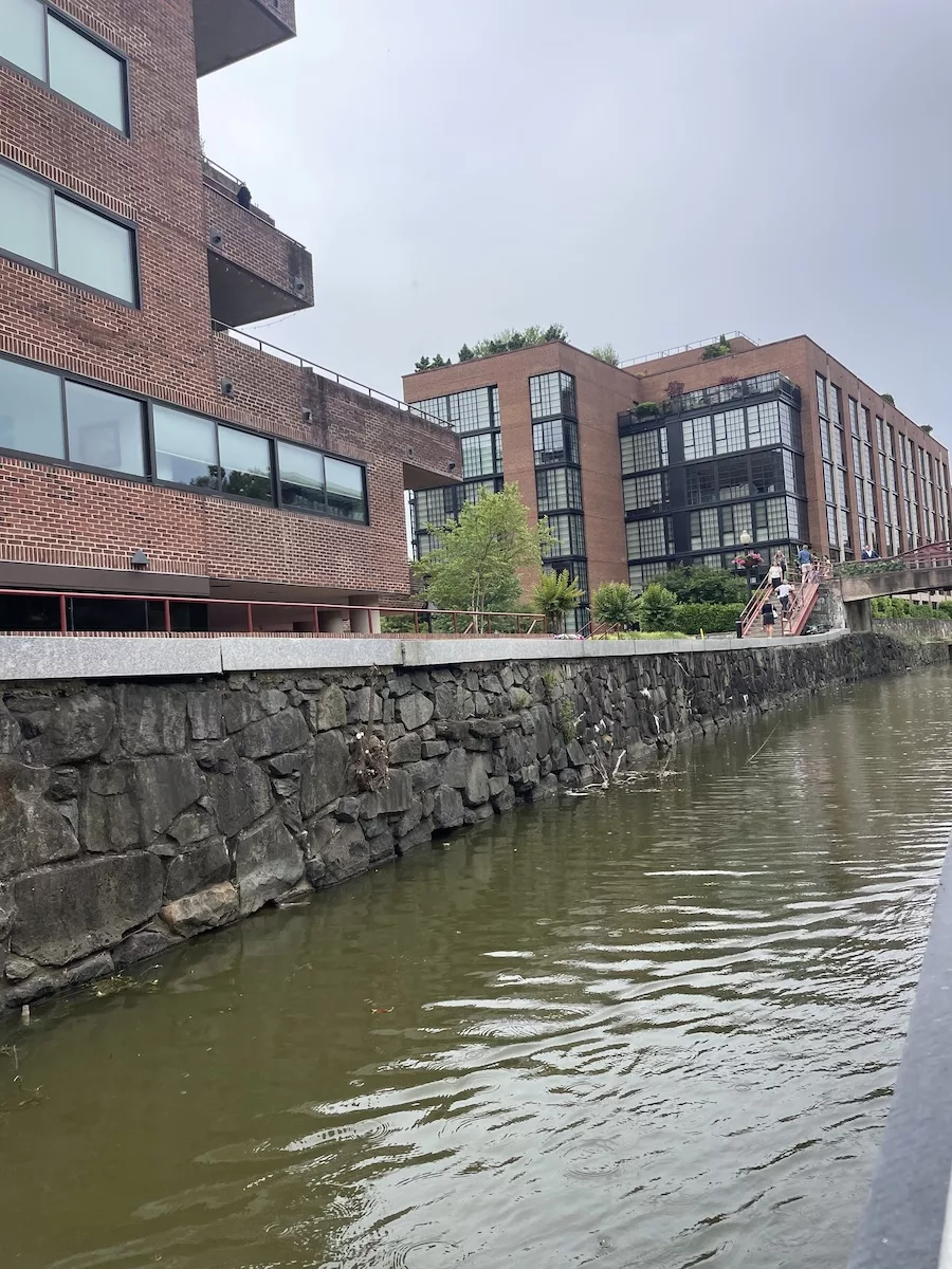 Image of the Potomac River from the C&O Canal, including brick office buildings