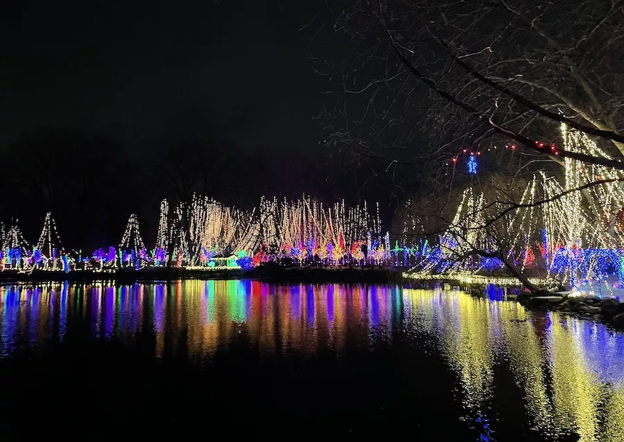 Colorful holiday lights lit up over lake - Holiday Light Show - Things to Do in Janesville