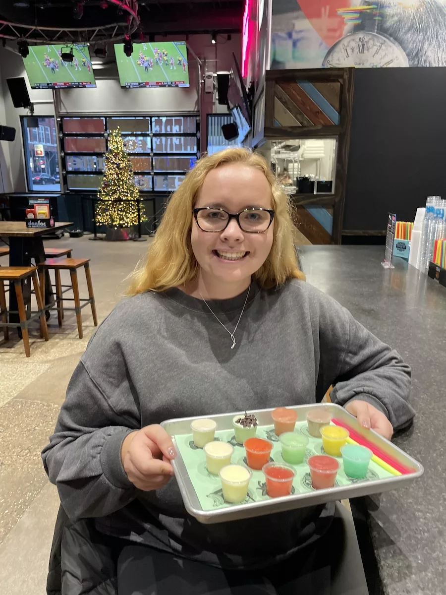 Image of young woman with a flight of sample daiquiris at Daq Fac in Davenport, Iowa