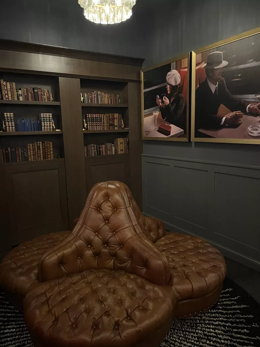 Image of comfy chairs and bookshelf at Garrirson Speakeasy in Davenport, Iowa 
