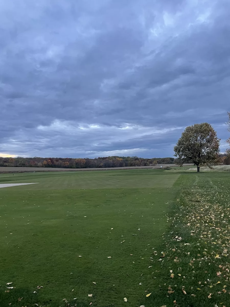 Image of portion of a golf course with a cloudy, dark sky - Madison Segment of Ice Age Trail 
