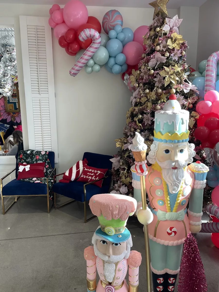 Life-sized Nutcrackers and pink holiday decorations 
