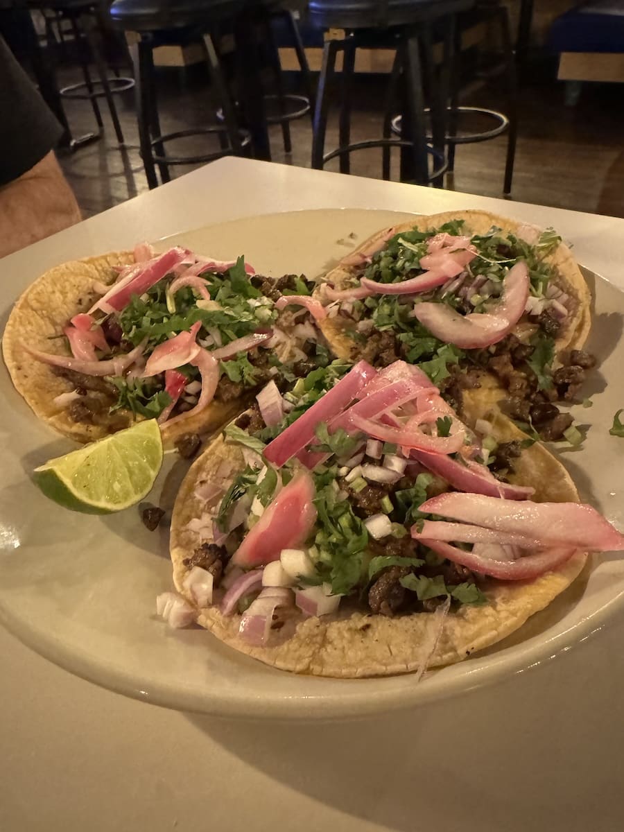 Imagge of three plated tacos at a Mexican restaurant in Jacksonville, FL. 