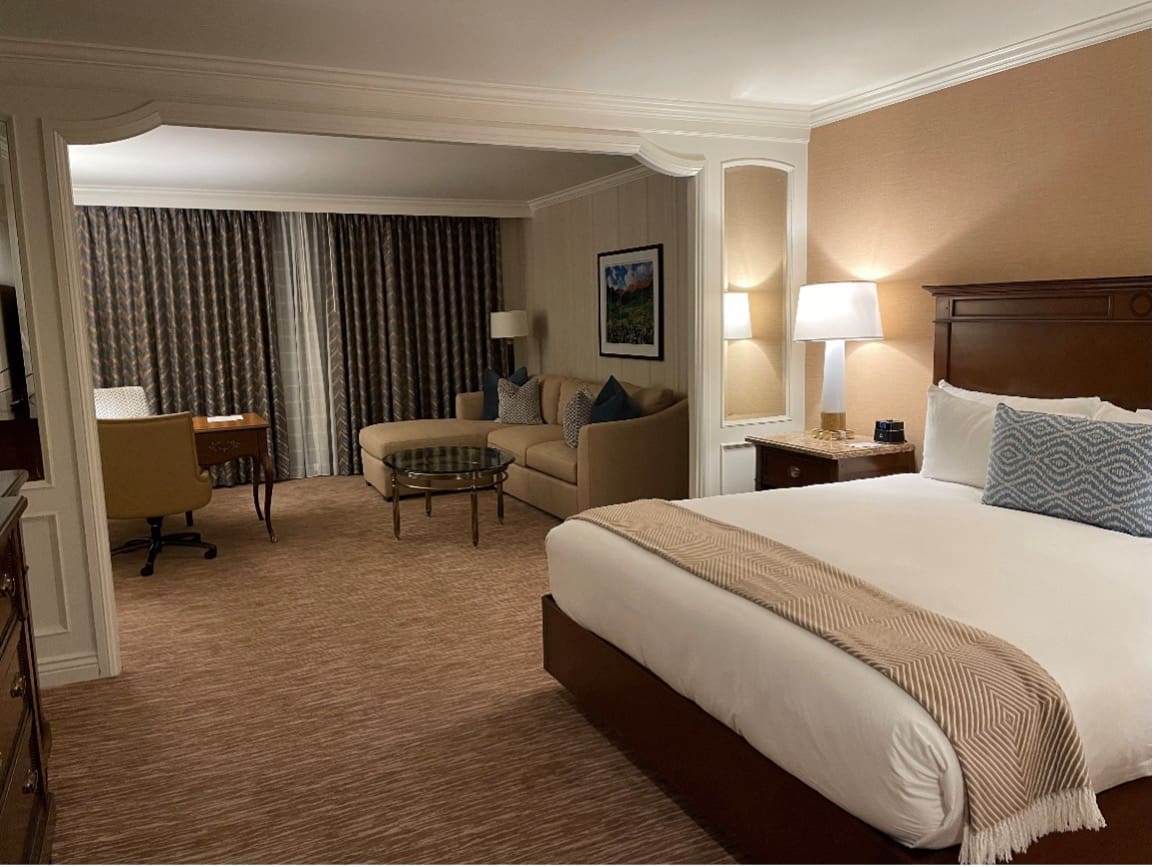 Image of hotel room including king-sized bed and seating area at the Little America Hotel Room in Salt Lake City