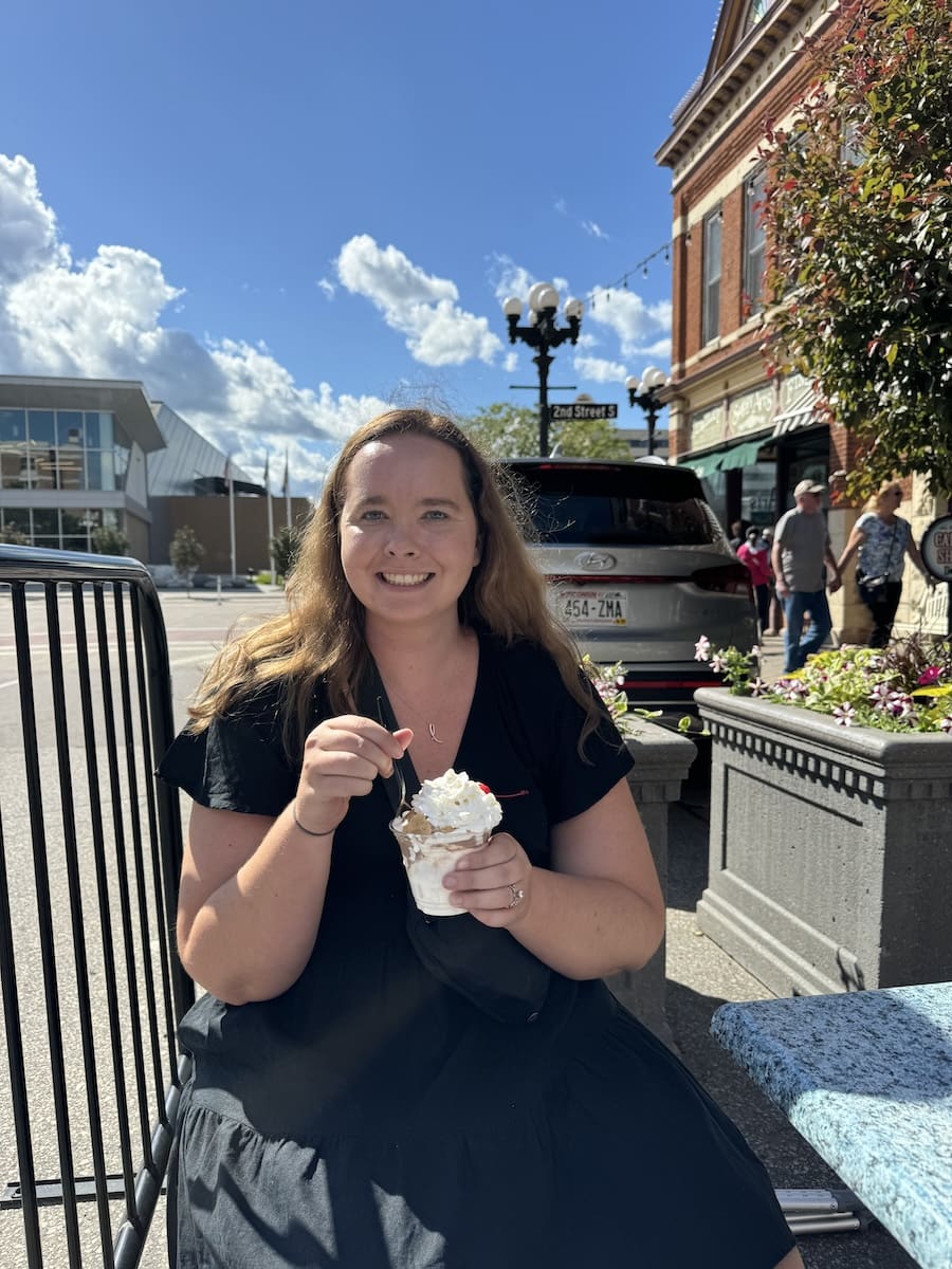 Woman eating a s'mores sundae from The Pearl - La Crosse, WI