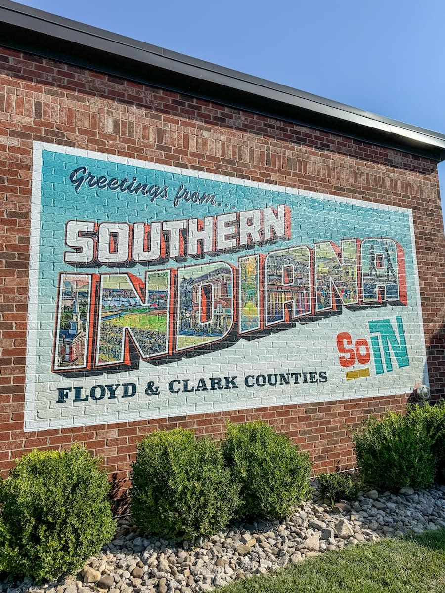 Road Trip to Southern Indiana - SoIN Tourism Welcome Sign on the side of a brick building