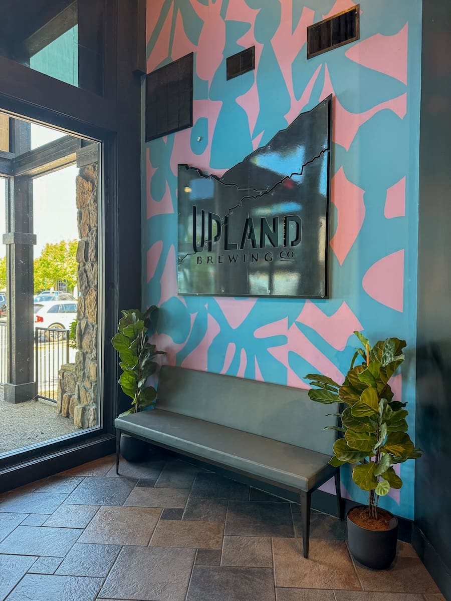 Image of an entrance to a restaurant and their sign - Upland Brewing, Jeffersonville, Indiana