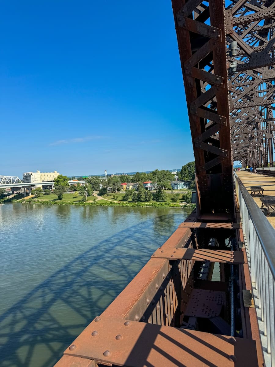 Profile of pedestrian bridge with views of the Ohio River. 