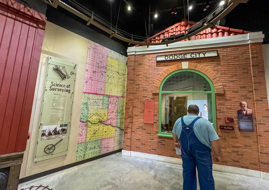 Image of a man learning about the history of Dodge City at the Boot Hill Museum - Kansas