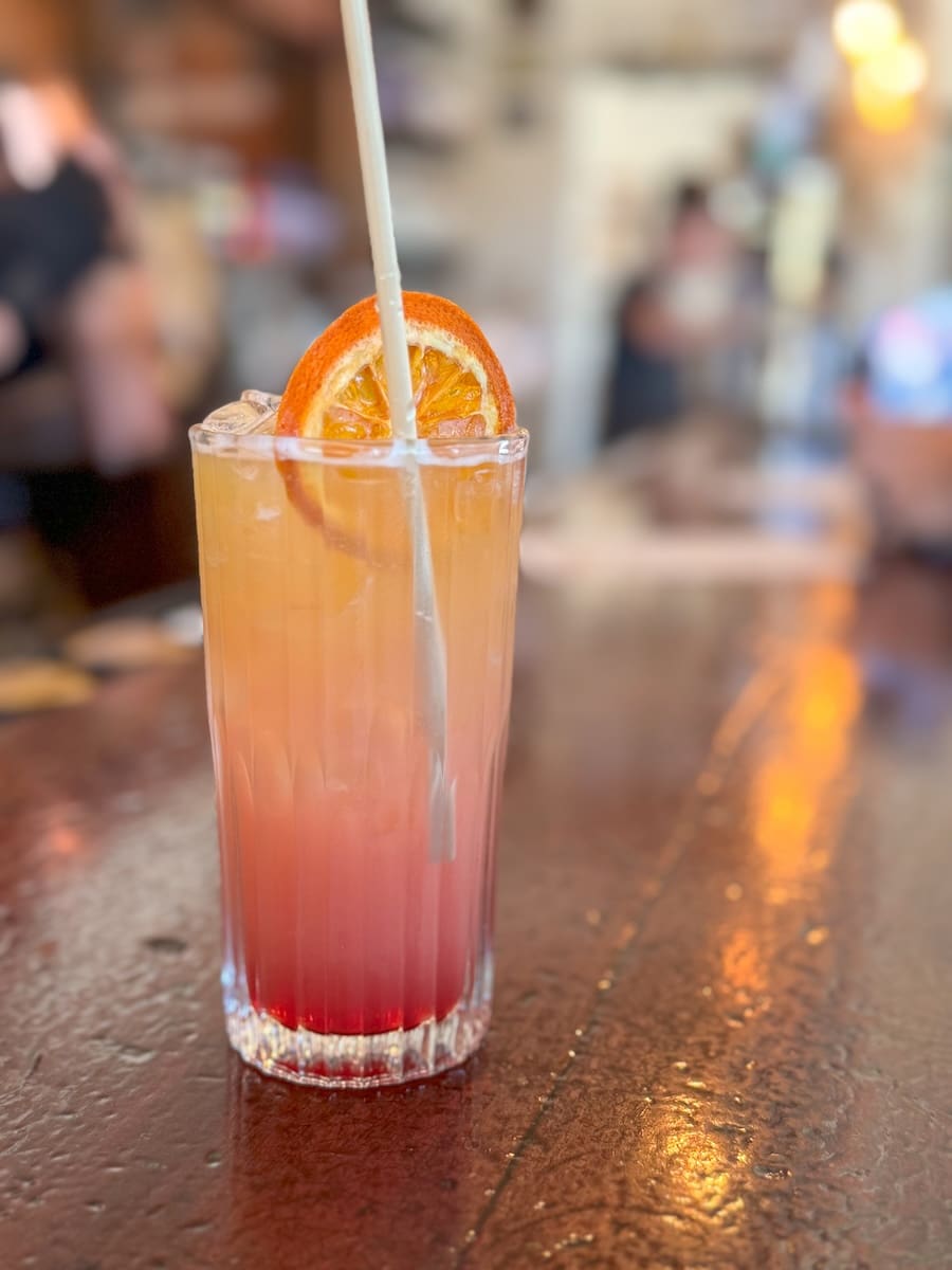 Image of colorful mocktail on top of bar at Boot Hill Distillery