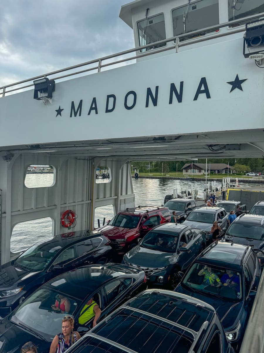 Image of vehicles parked very close together on a car ferry. 