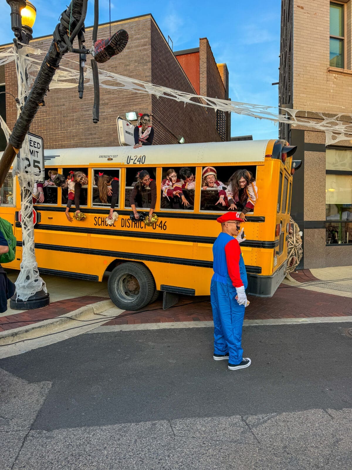 Image of zombie-looking kids on a yellow school bus for the Nightmare on Chicago Street Event 