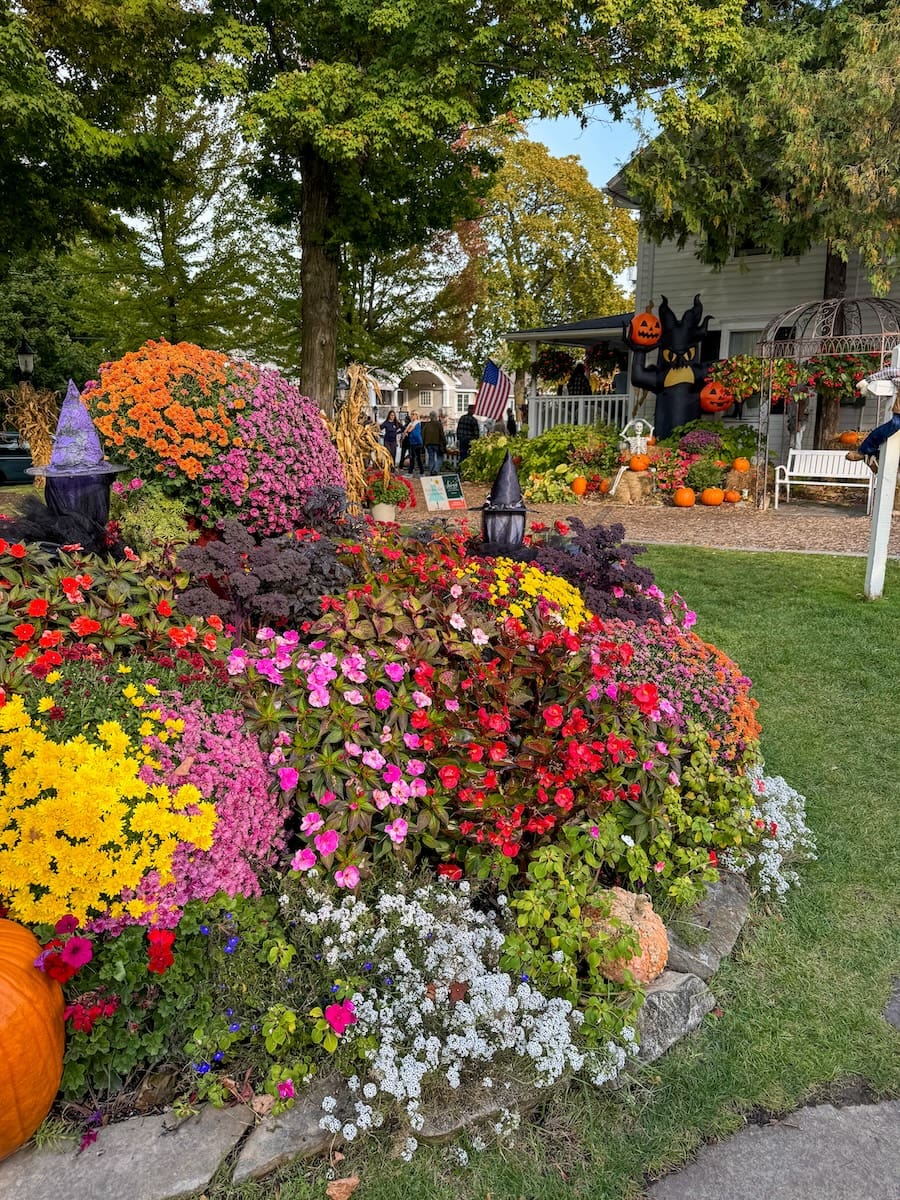 Image of bright fall flowers surrounding a shopping area in Fish Creek, Door County - Wisconsin Weekend Getaway